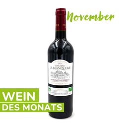 KI generiert: Das Bild zeigt eine Flasche Château La Blanquerie Bordeaux Supérieur, die als "Wein des Monats" für November präsentiert wird. Der Wein ist aus dem Jahr 2021 und trägt Bio-Zertifizierungen auf dem Etikett.