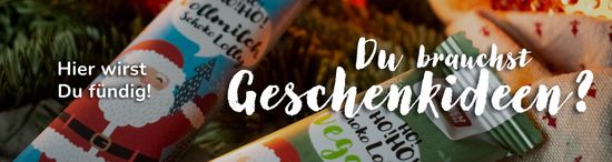 KI generiert: Das Bild zeigt Weihnachtssüßigkeiten mit einem aufgedruckten Weihnachtsmann und den Schriftzug "Du brauchst Geschenkideen? Hier wirst Du fündig!" im Vordergrund. Der Hauptinhalt suggeriert die Suche nach Geschenkideen.