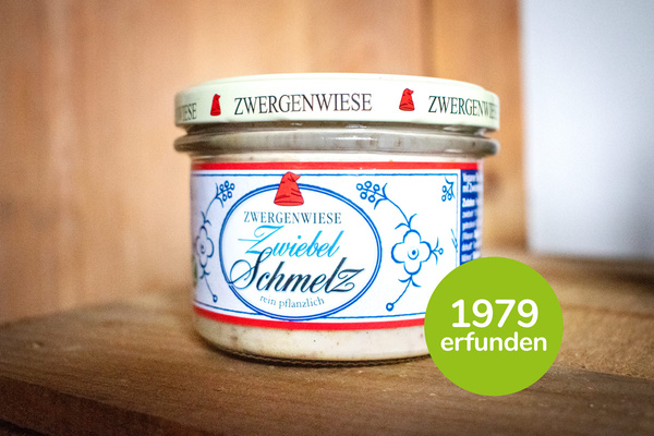 KI generiert: Ein Glas Zwergenwiese Zwiebel Schmelz, rein pflanzlich. Text: "1979 erfunden".