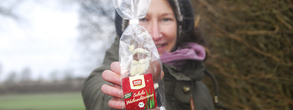 Hand mit Weihnachtsmann